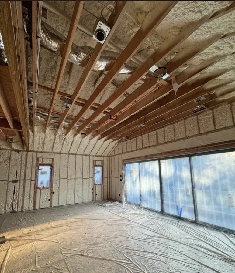 Interior walls and ceiling insulated with spray foam during new construction in Closter